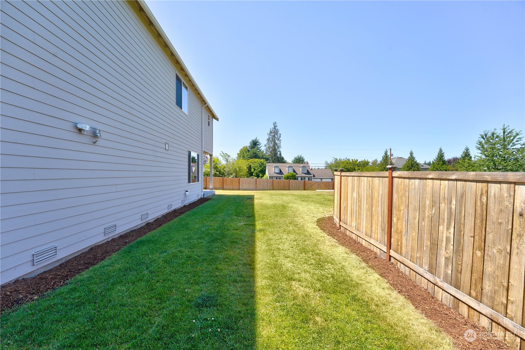 8808 Northeast 201st Place Bothell, WA 98011 - Photo 36 of 38 a view of a backyard with sitting area