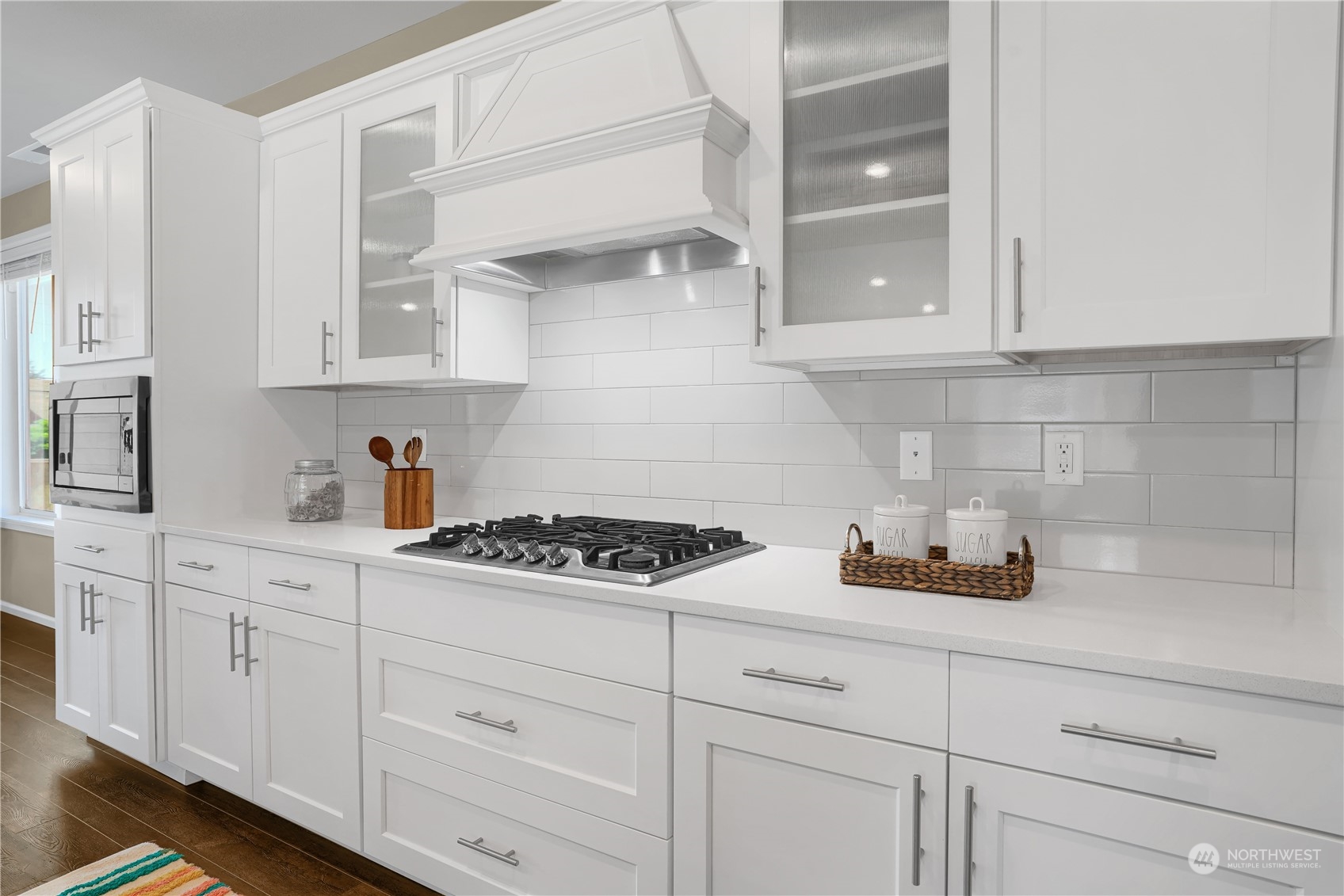 8808 Northeast 201st Place Bothell, WA 98011 - Photo 7 of 38 a kitchen with white cabinets and white appliances