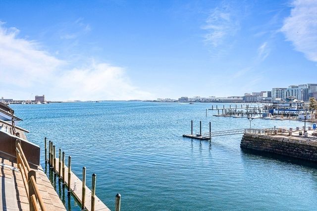 a view of roof deck with ocean view