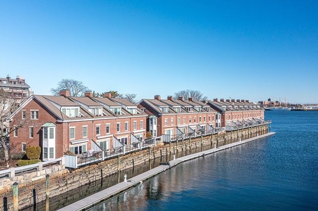 a view of a large building with a city skyline