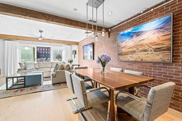 a view of a dining room with furniture window and outside view