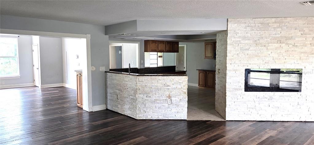 2766 Duffer Road Sebring, FL 33872 - Photo 14 of 63 a view of a living room with wooden floor and furniture