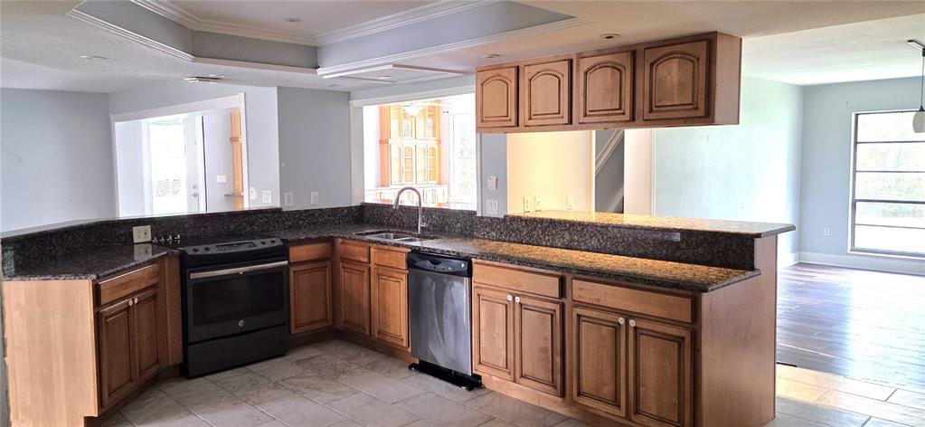 2766 Duffer Road Sebring, FL 33872 - Photo 15 of 63 a kitchen with stainless steel appliances granite countertop a sink and a granite counter tops