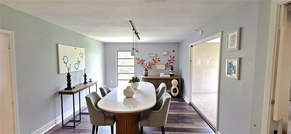 2766 Duffer Road Sebring, FL 33872 - Photo 19 of 63 a view of a dining room with furniture and window