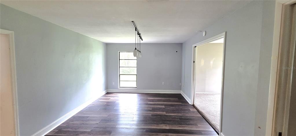2766 Duffer Road Sebring, FL 33872 - Photo 20 of 63 a view of empty room with wooden floor and fan