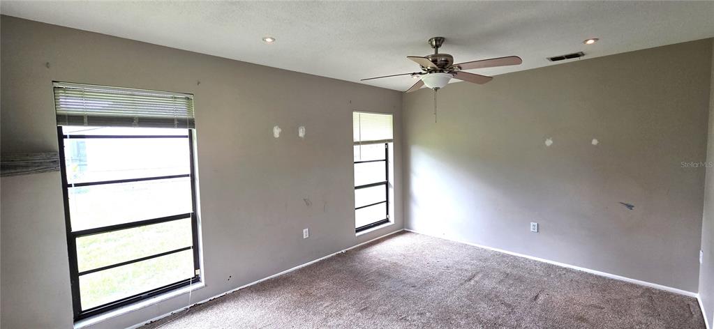 2766 Duffer Road Sebring, FL 33872 - Photo 32 of 63 wooden floor in an empty room with a window