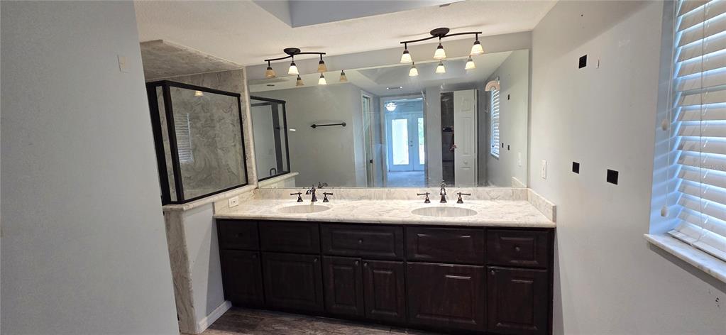 2766 Duffer Road Sebring, FL 33872 - Photo 33 of 63 a bathroom with a double vanity sink and mirror