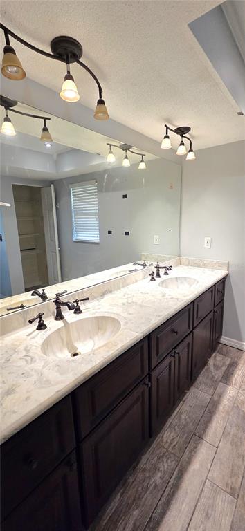 2766 Duffer Road Sebring, FL 33872 - Photo 35 of 63 a bathroom with a double vanity sink and a mirror