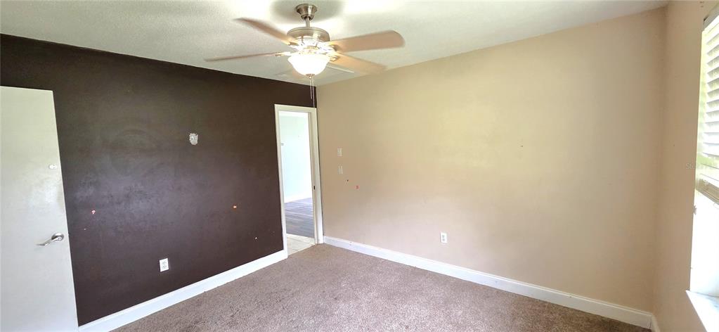 2766 Duffer Road Sebring, FL 33872 - Photo 39 of 63 an empty room with a ceiling fan and a window