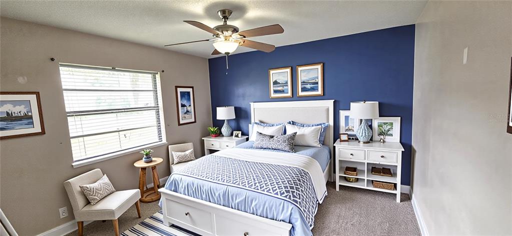 2766 Duffer Road Sebring, FL 33872 - Photo 42 of 63 a bedroom with a bed chandelier and a window