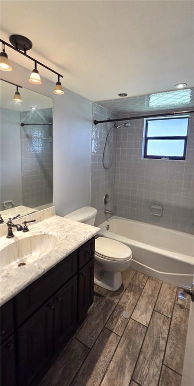 2766 Duffer Road Sebring, FL 33872 - Photo 46 of 63 a bathroom with a granite countertop sink toilet a mirror and bathtub