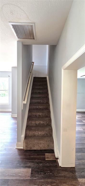 2766 Duffer Road Sebring, FL 33872 - Photo 48 of 63 a view of entryway and hall with wooden floor