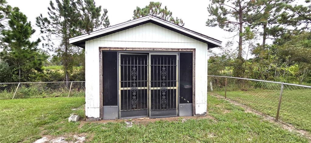 2766 Duffer Road Sebring, FL 33872 - Photo 62 of 63 a view of small house with a small yard