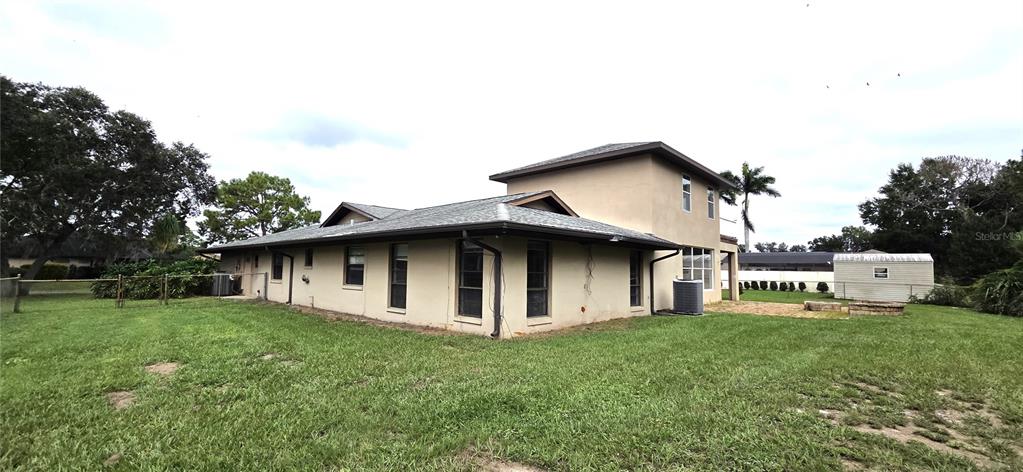 2766 Duffer Road Sebring, FL 33872 - Photo 7 of 63 a house with green field in front of it