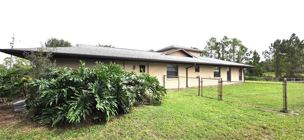 2766 Duffer Road Sebring, FL 33872 - Photo 8 of 63 a view of a house with a backyard