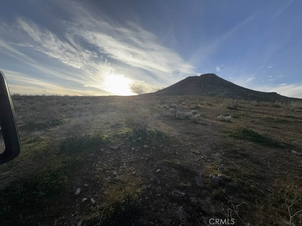 0 Unknown Street Apple Valley, CA 92307 - Photo 8 of 9 a view of a dry yard with mountains in the background