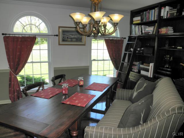 136 South Penn Dixie Road Nazareth, PA 18064 - Photo 15 of 30 a view of a dining room with furniture a chandelier and wooden floor