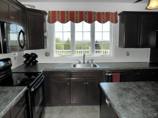 136 South Penn Dixie Road Nazareth, PA 18064 - Photo 20 of 30 a kitchen with a stove and a sink