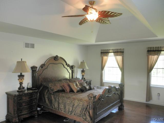 136 South Penn Dixie Road Nazareth, PA 18064 - Photo 24 of 30 a bedroom with a bed and a chandelier