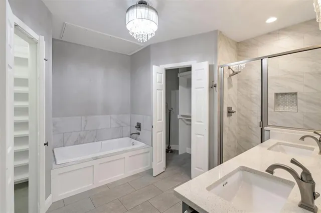 a bathroom with a bathtub and a sink