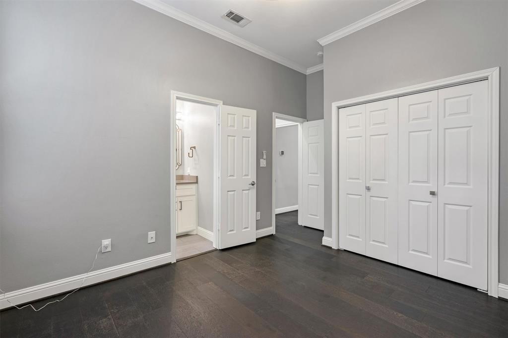 4511 Gilbert Avenue, Unit 108 Dallas, TX 75219 - Photo 17 of 25 a view of a livingroom with wooden floor and closet area
