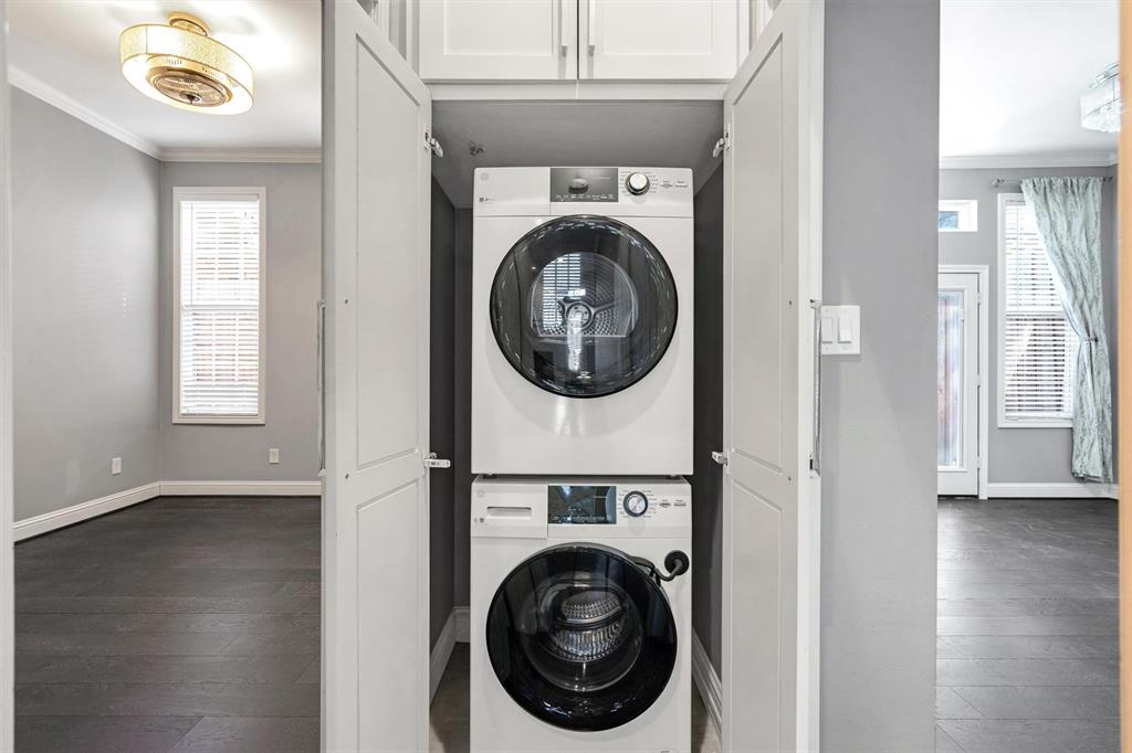 4511 Gilbert Avenue, Unit 108 Dallas, TX 75219 - Photo 19 of 25 a utility room with dryer and washer