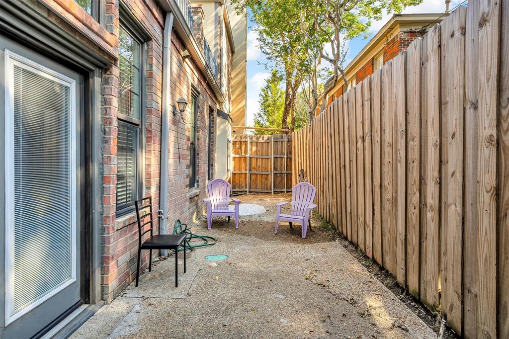 4511 Gilbert Avenue, Unit 108 Dallas, TX 75219 - Photo 20 of 25 a backyard of a house with outdoor seating