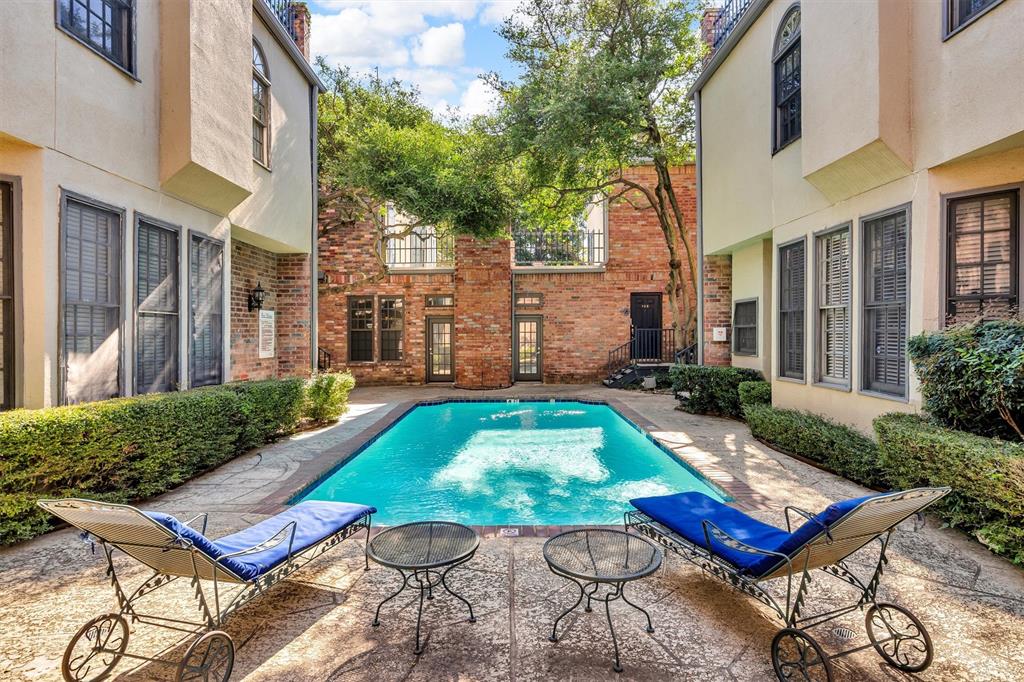 4511 Gilbert Avenue, Unit 108 Dallas, TX 75219 - Photo 2 of 25 a view of a backyard with sitting area