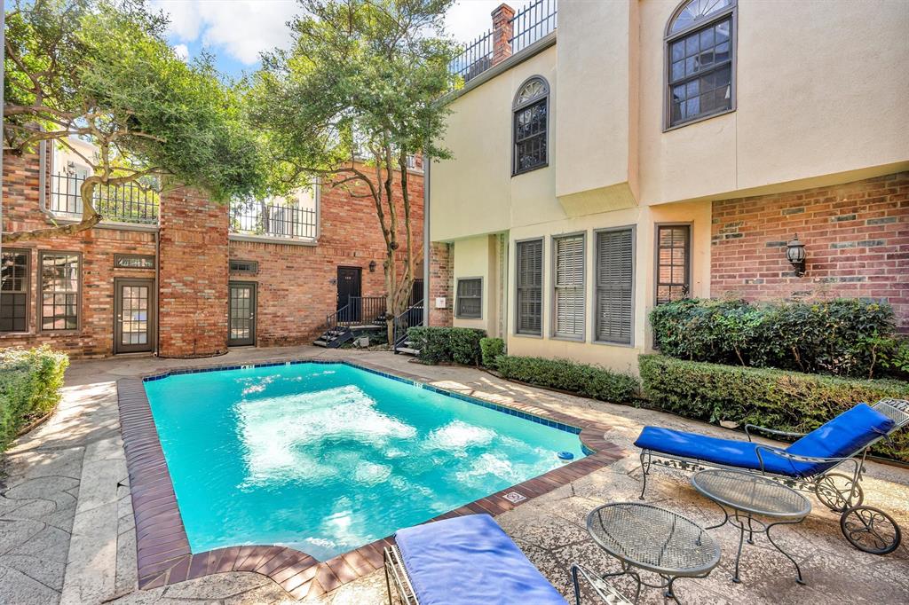 4511 Gilbert Avenue, Unit 108 Dallas, TX 75219 - Photo 22 of 25 a view of a house with backyard swimming pool and sitting area