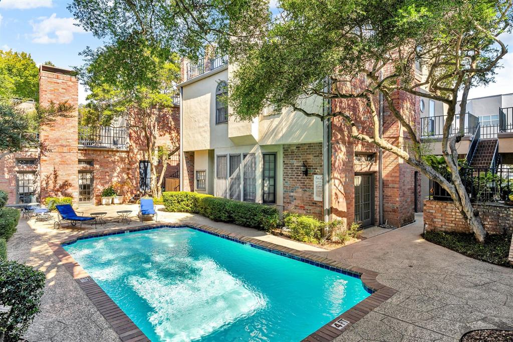 4511 Gilbert Avenue, Unit 108 Dallas, TX 75219 - Photo 23 of 25 a view of a house with swimming pool and sitting area