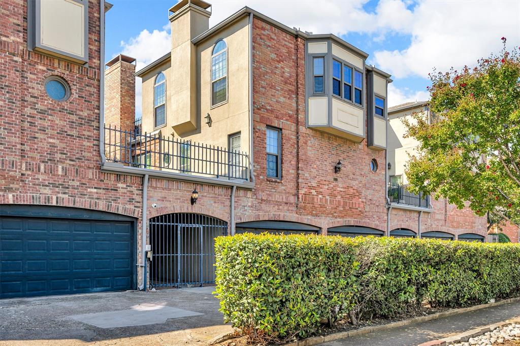 4511 Gilbert Avenue, Unit 108 Dallas, TX 75219 - Photo 24 of 25 a front view of a building with a garden