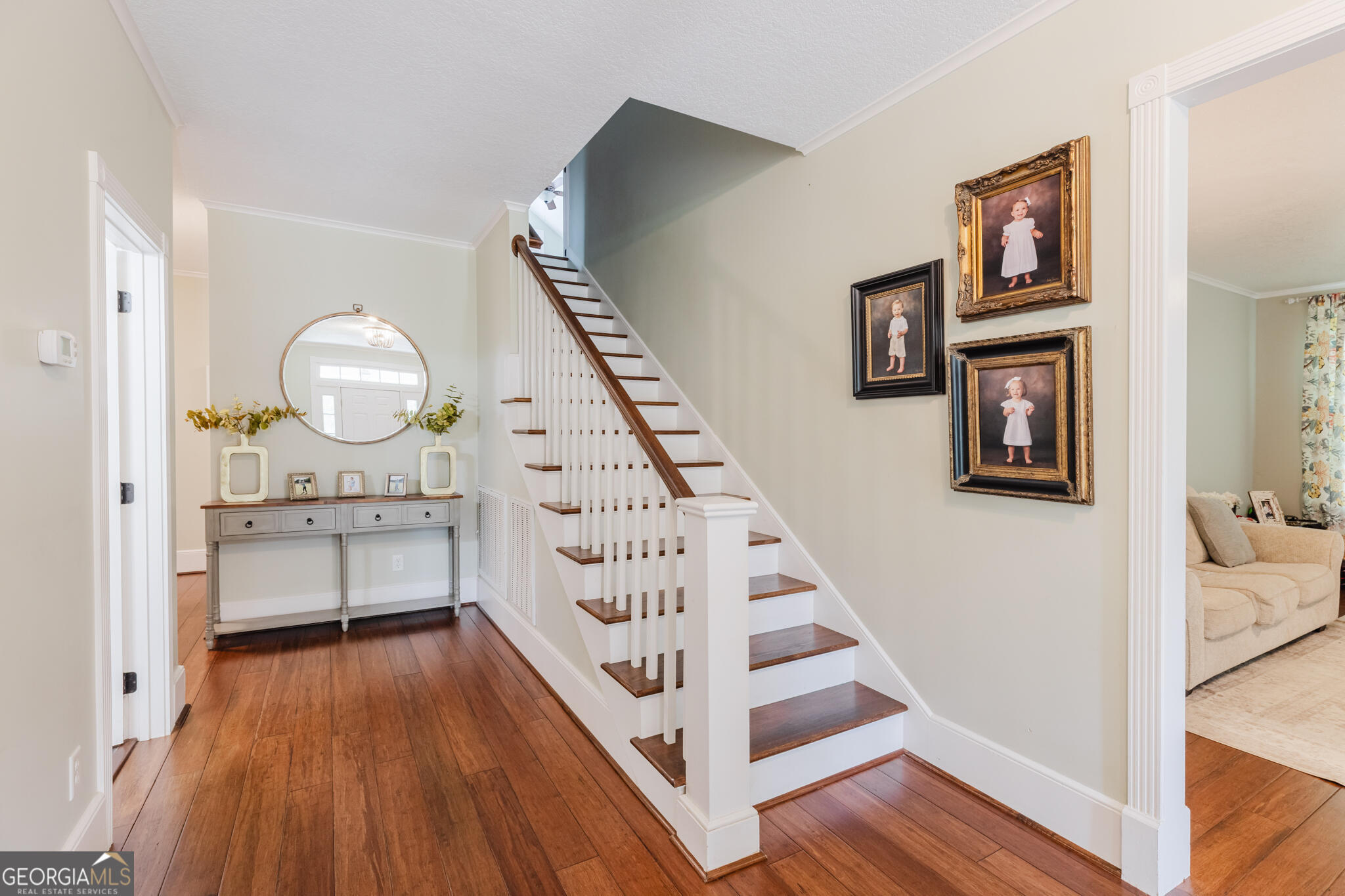 1859 Upper River Road Americus, GA 31709 - Photo 18 of 47 a view of a hallway with wooden floor and staircase
