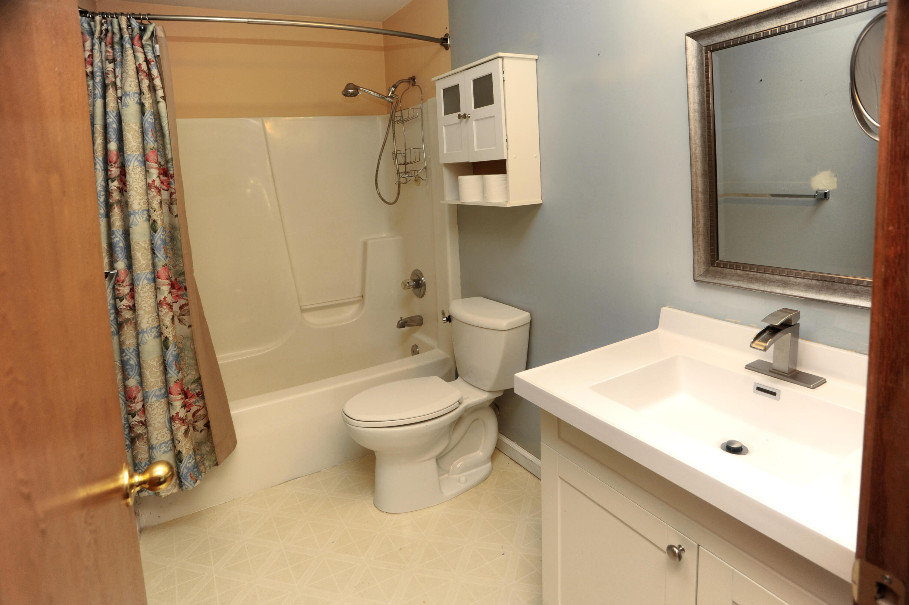 216 Summertree Drive Porter, IN 46304 - Photo 18 of 28 a white toilet sitting next to a bathroom sink