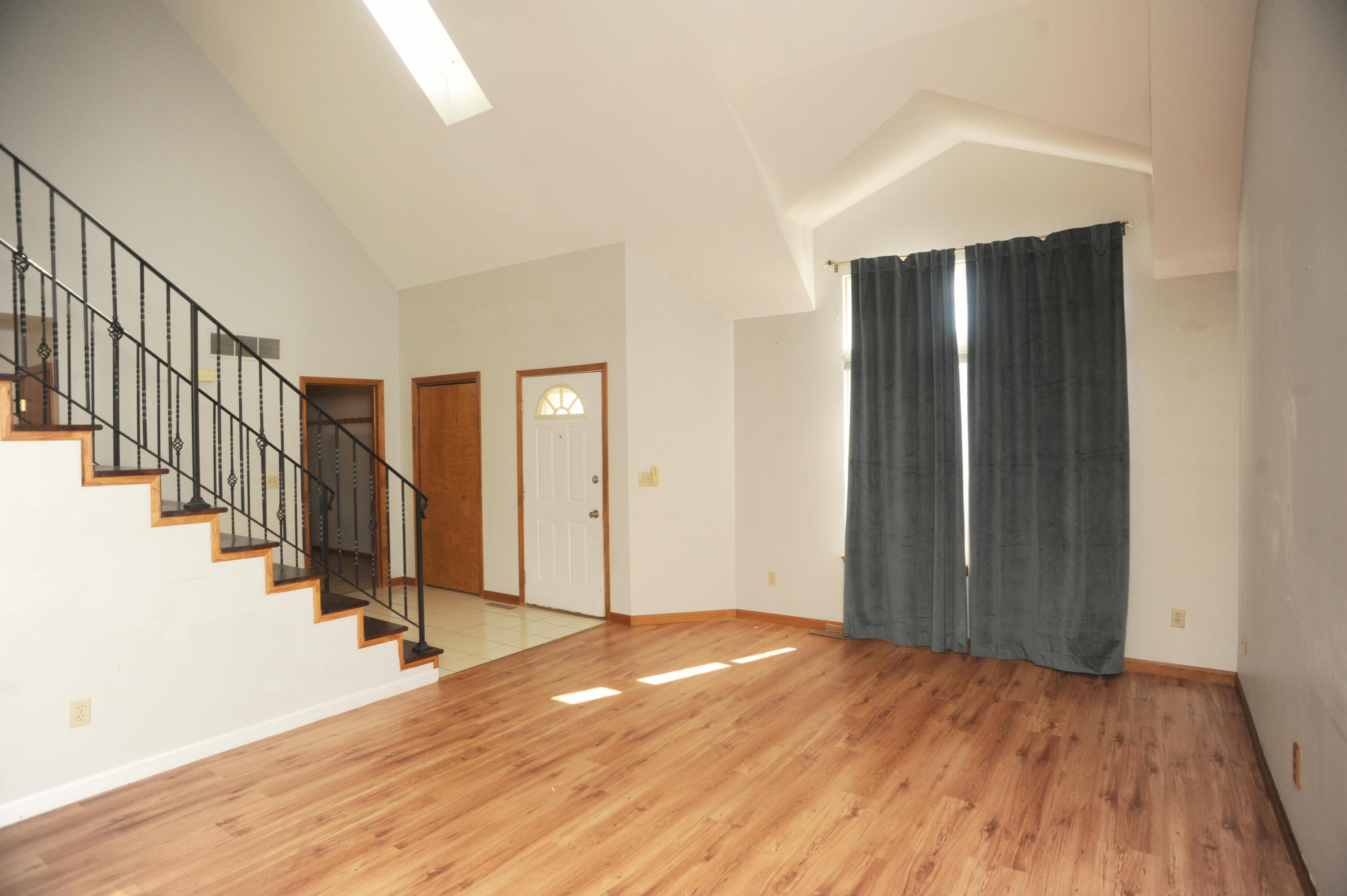 216 Summertree Drive Porter, IN 46304 - Photo 3 of 28 a view of a room with wooden floor and stairs