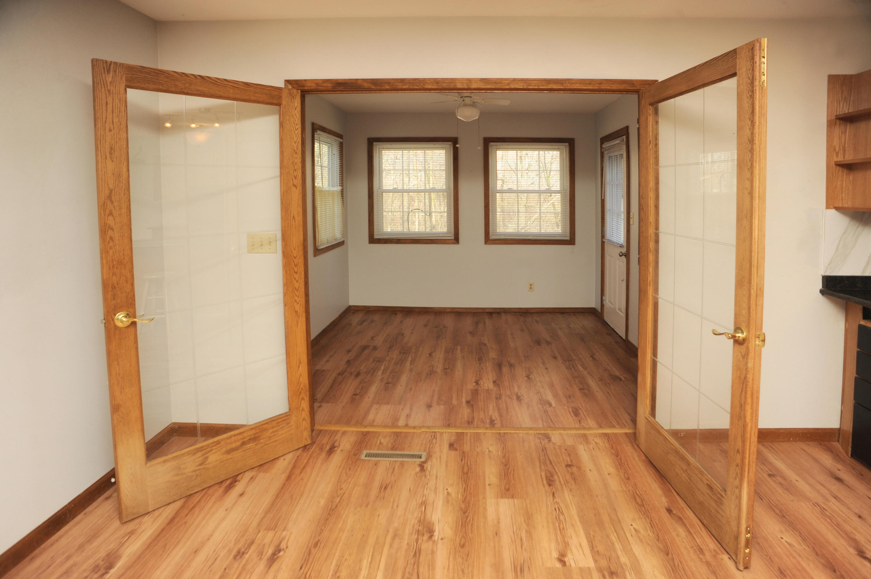 216 Summertree Drive Porter, IN 46304 - Photo 5 of 28 wooden floor in an empty room with a window