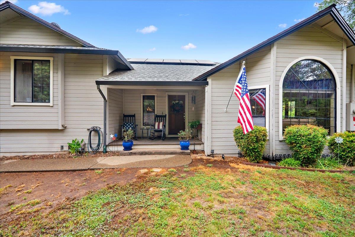 a front view of a house with garden