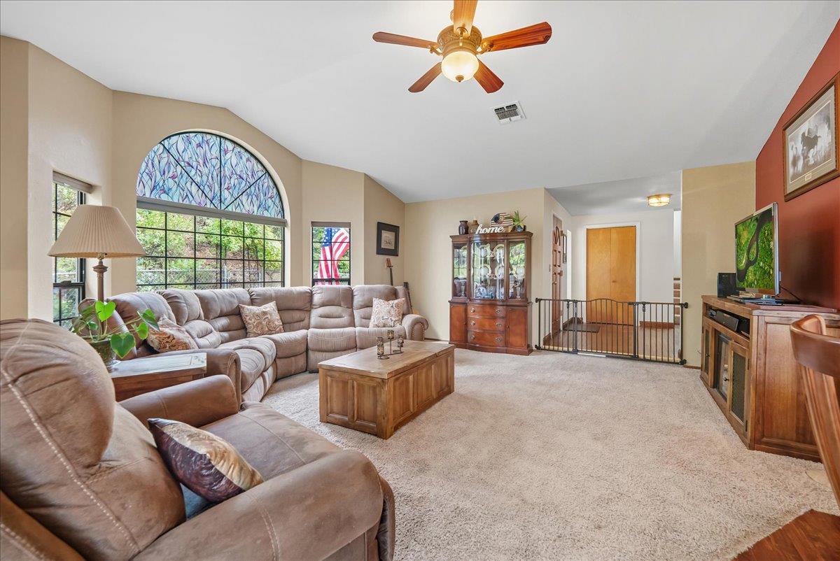 2527 Dynamic Way Rescue, CA 95672 - Photo 3 of 37 a living room with furniture a window and a flat screen tv