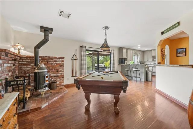 a room with lots of furniture and a wooden floor