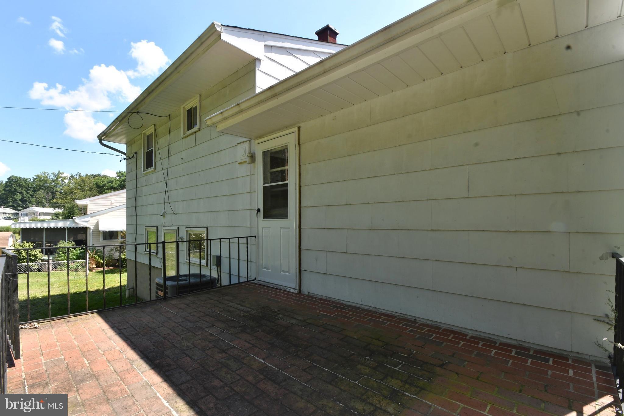 9222 Orbitan Road Baltimore, MD 21234 - Photo 25 of 27 Back brick patio