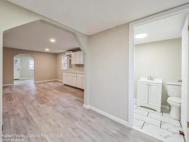 a view of a kitchen cabinets and wooden floor