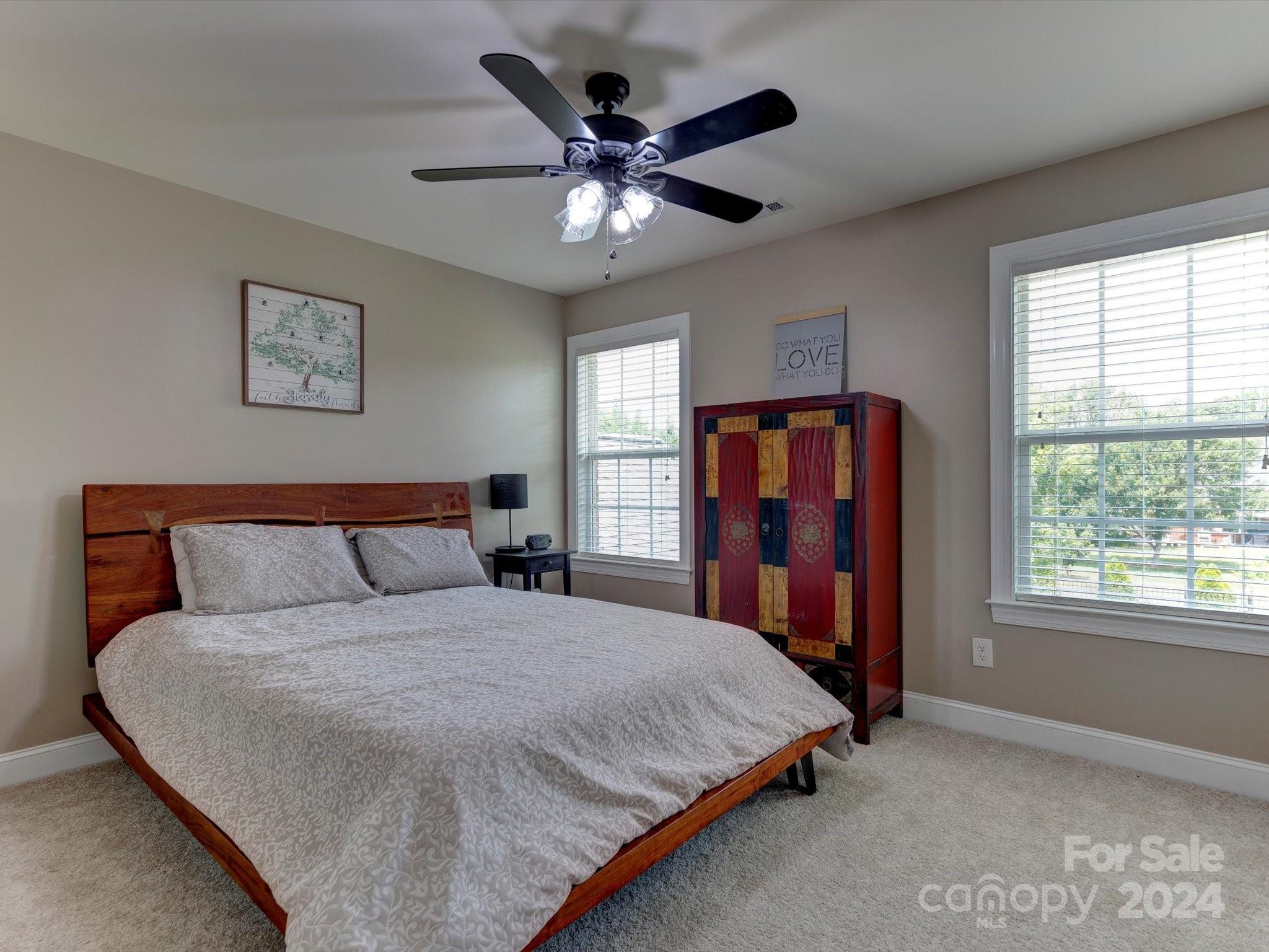 4403 Zee Court Monroe, NC 28110 - Photo 19 of 35 a bed room with a bed and a large window
