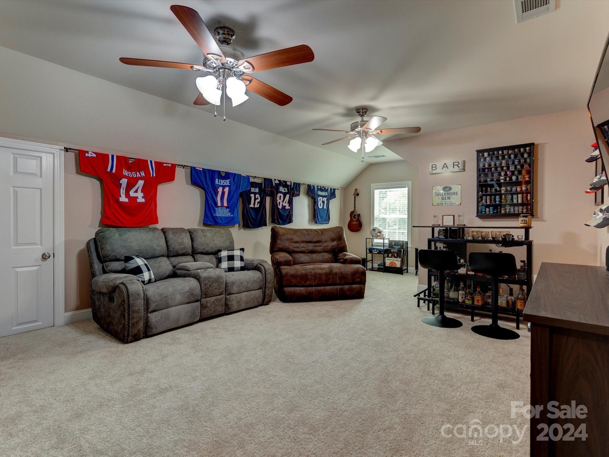 4403 Zee Court Monroe, NC 28110 - Photo 22 of 35 a living room with furniture a chandelier fan and a window