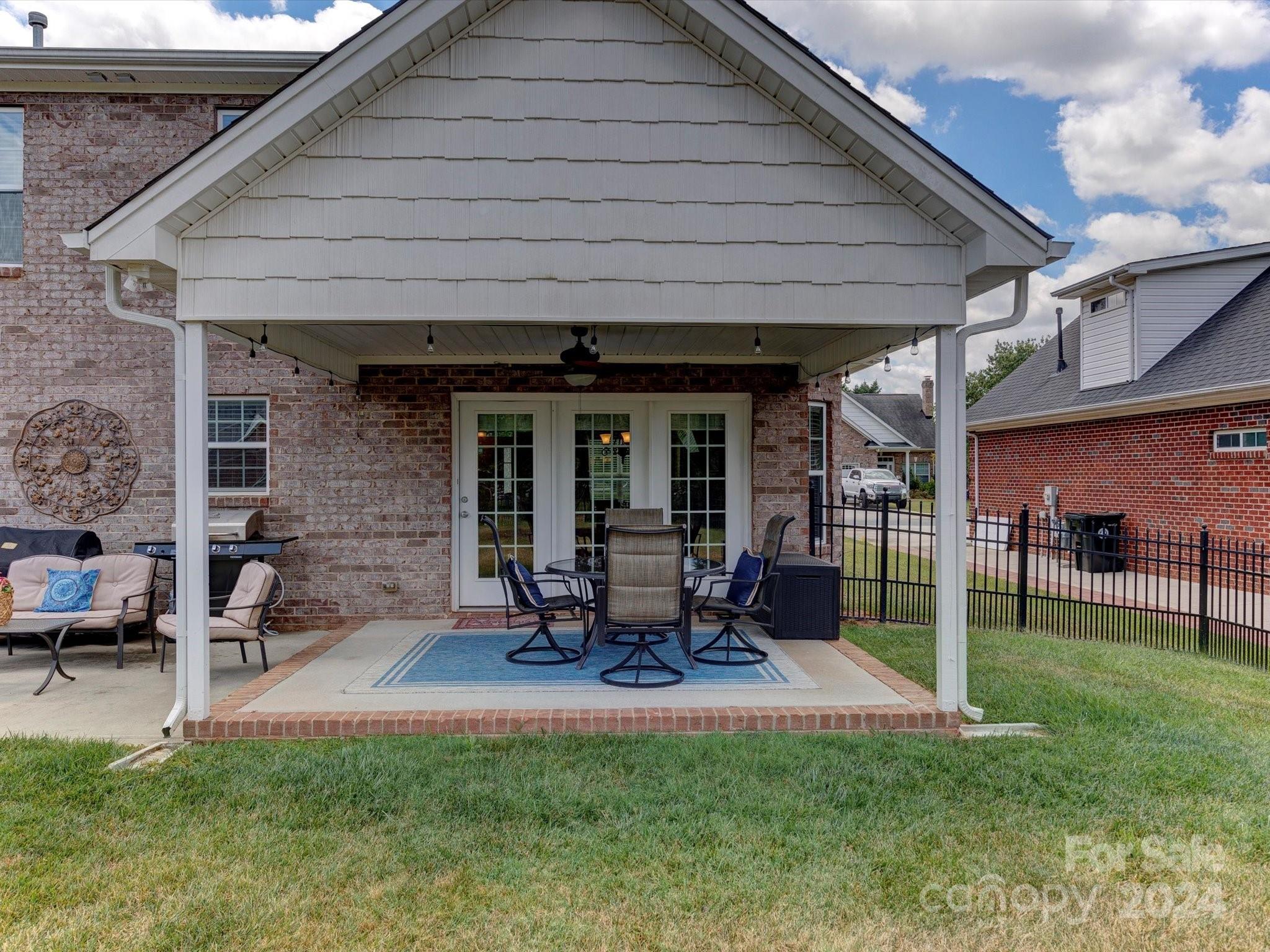 4403 Zee Court Monroe, NC 28110 - Photo 24 of 35 a view of a house with backyard porch and sitting area