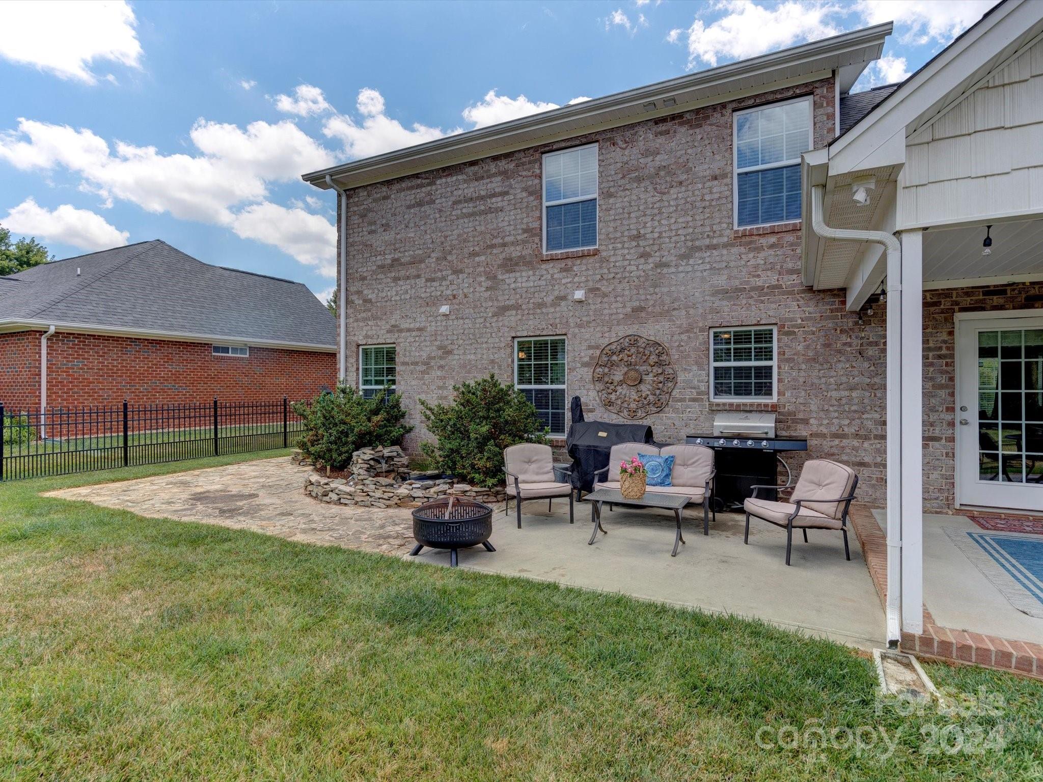 4403 Zee Court Monroe, NC 28110 - Photo 25 of 35 a view of a house with backyard and sitting area