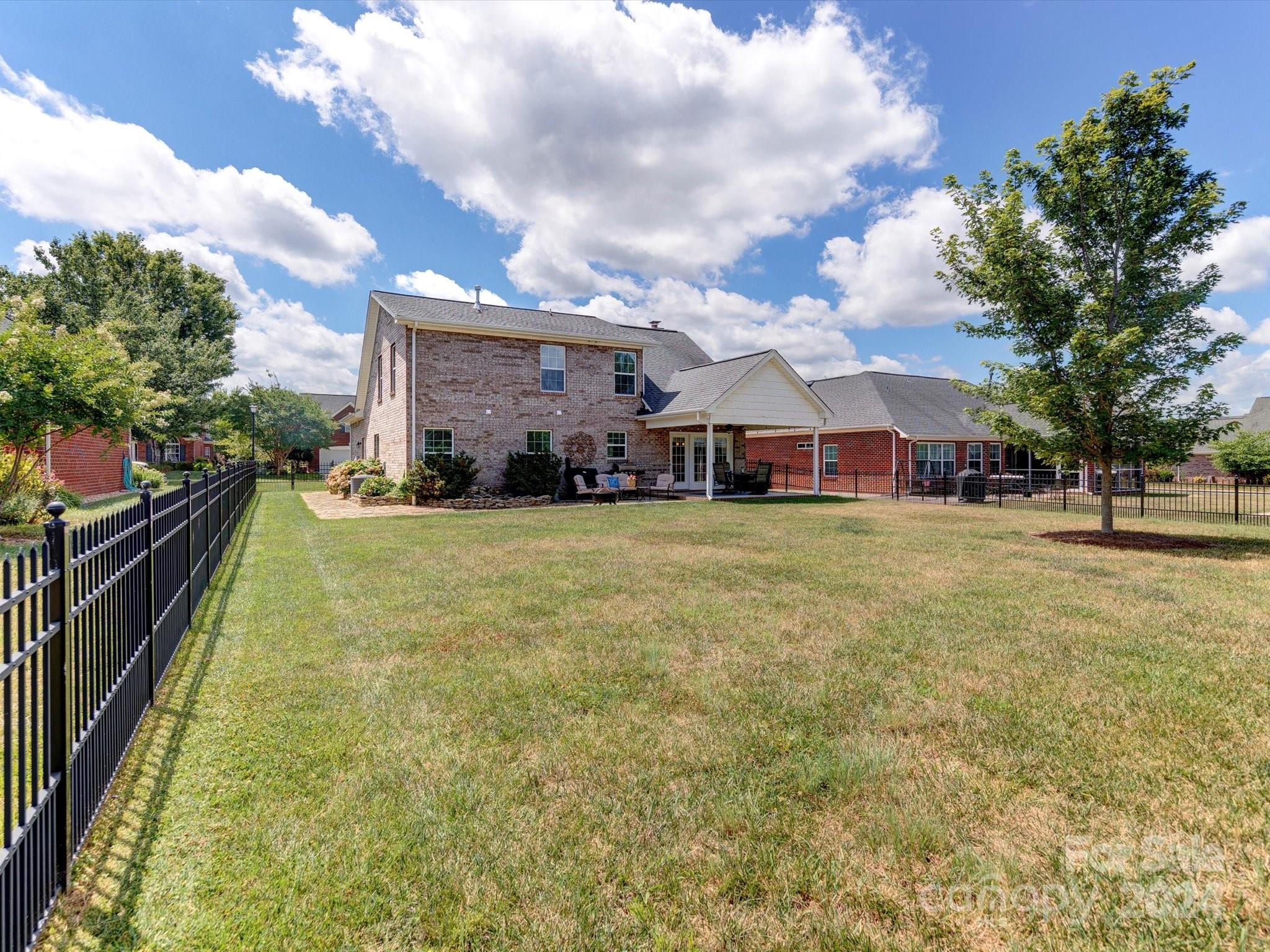 4403 Zee Court Monroe, NC 28110 - Photo 27 of 35 a view of yard with swimming pool and green space