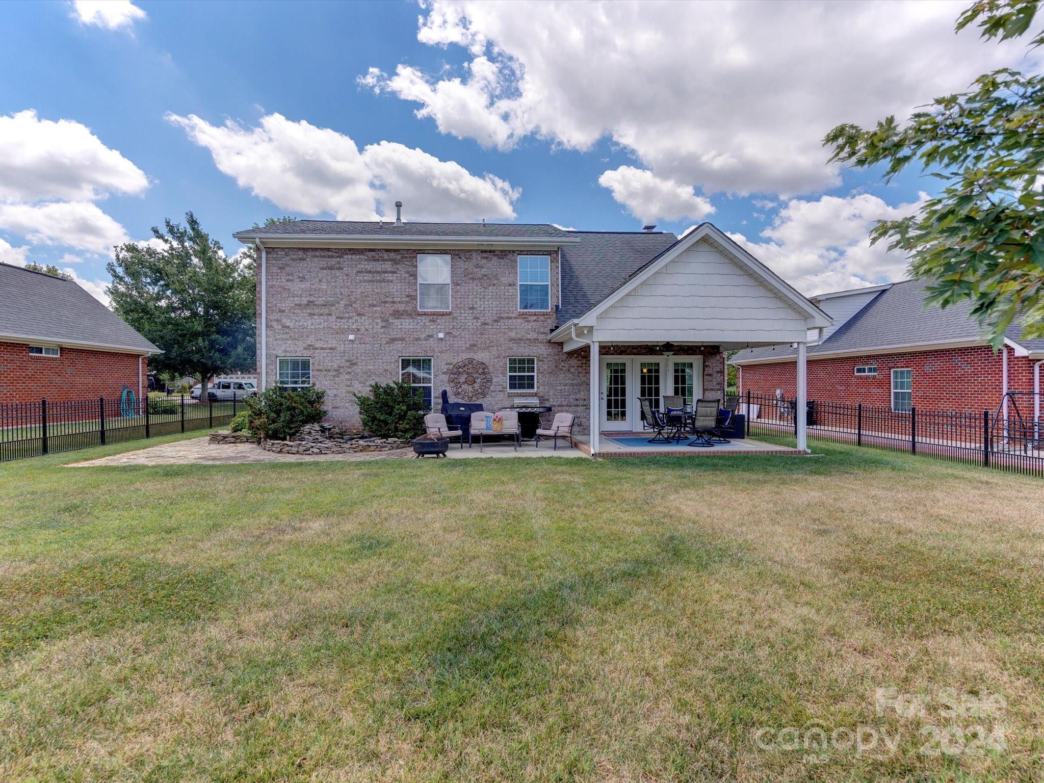 4403 Zee Court Monroe, NC 28110 - Photo 29 of 35 a view of a house with a backyard porch and sitting area