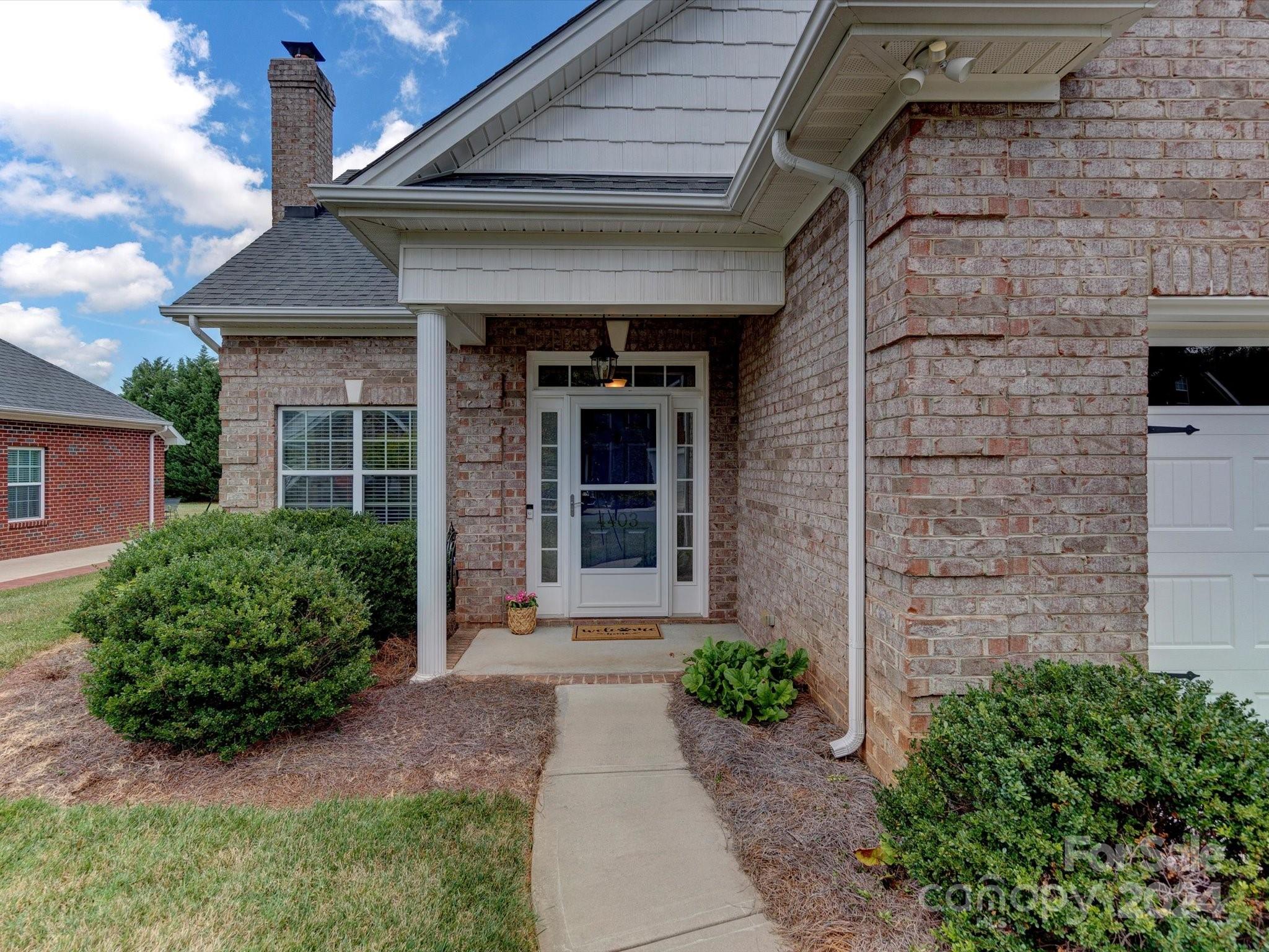 4403 Zee Court Monroe, NC 28110 - Photo 4 of 35 a front view of a house with garden