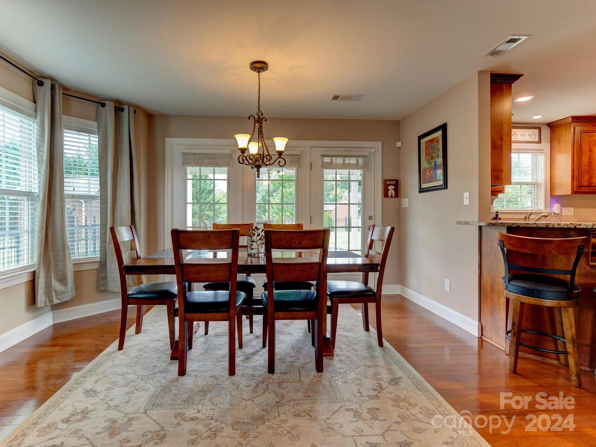 4403 Zee Court Monroe, NC 28110 - Photo 8 of 35 a view of a dining room with furniture window and wooden floor