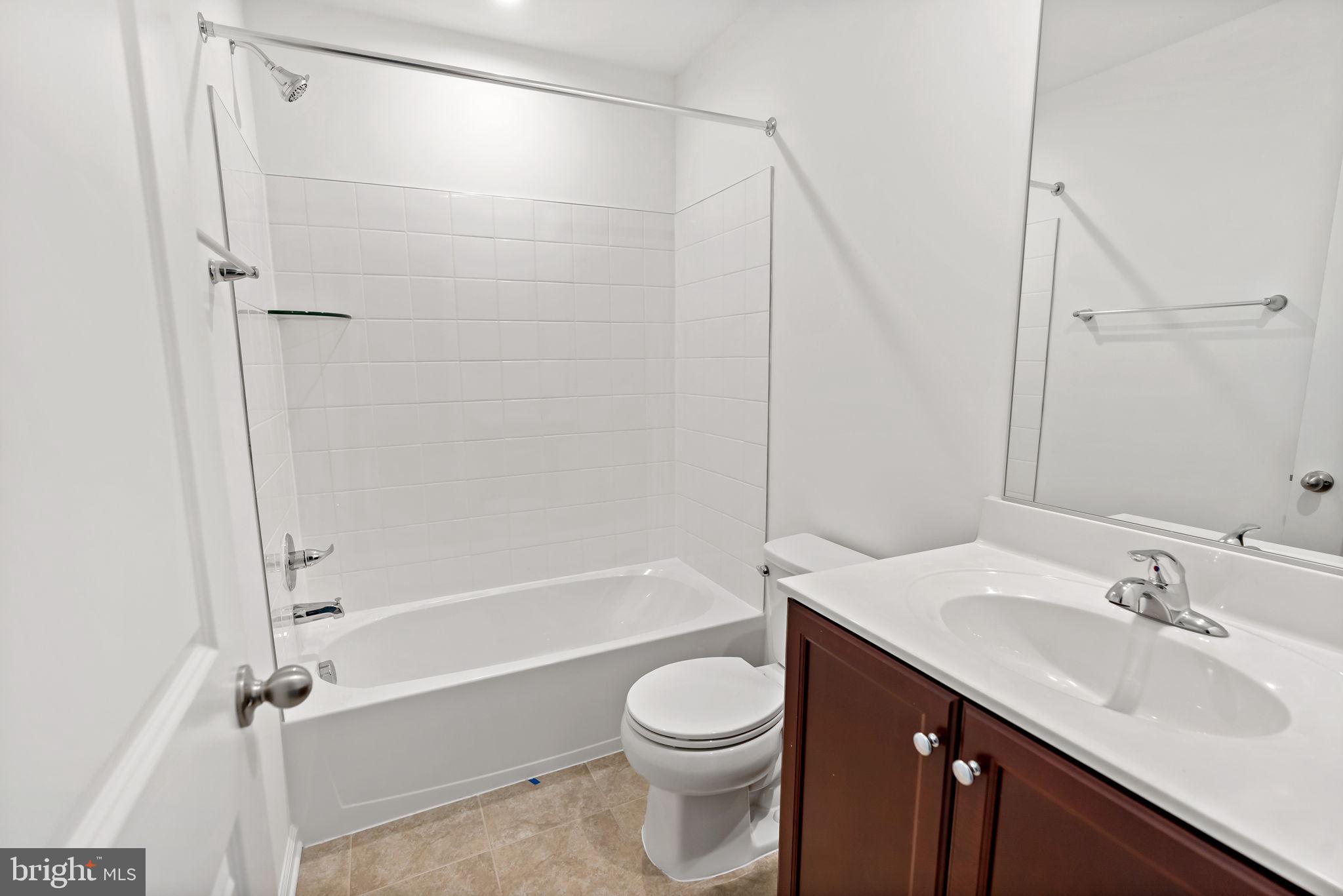 171 Grayling Road Inwood, WV 25428 - Photo 17 of 39 a bathroom with a sink a toilet and a bathtub