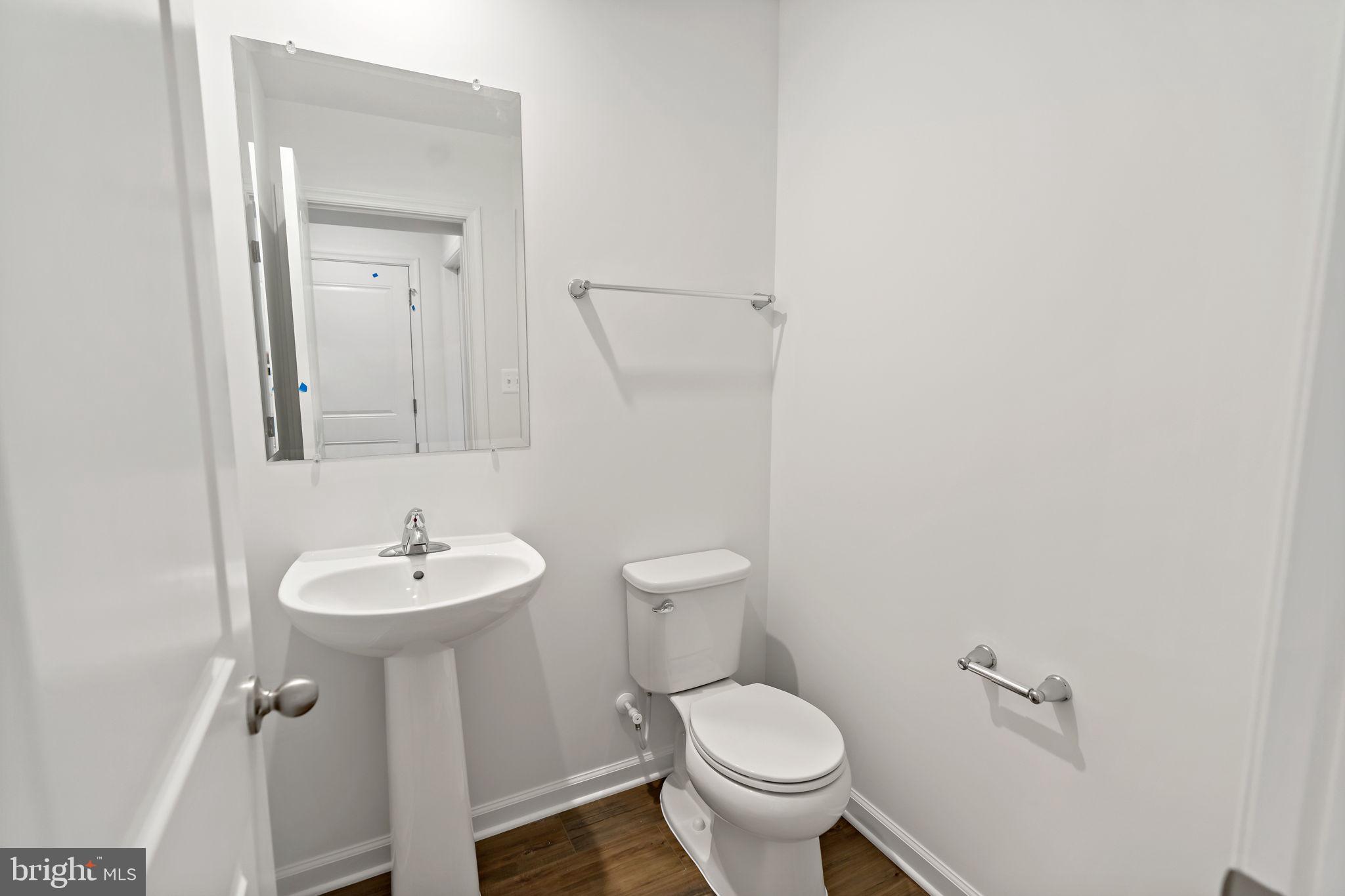 171 Grayling Road Inwood, WV 25428 - Photo 23 of 39 a bathroom with a toilet sink and mirror